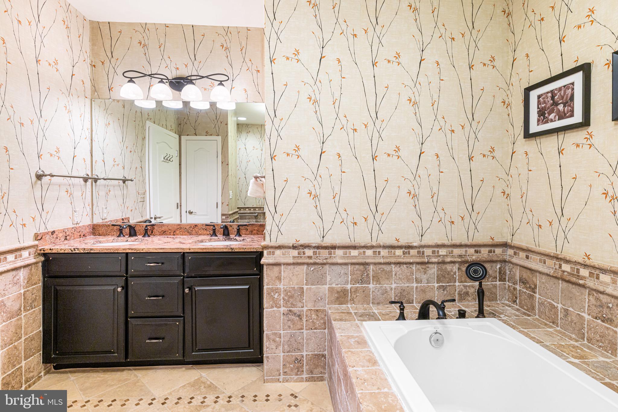 227 Carson Terrace Huntingdon Valley, PA 19006 - Photo 20 of 32 a bathroom with a sink and a bathtub