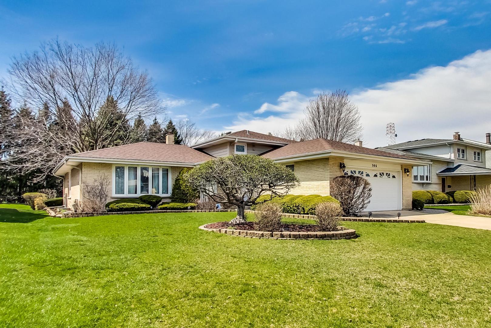 306 North Marcella Road Mount Prospect, IL 60056 - Photo 1 of 31 a front view of a house with garden