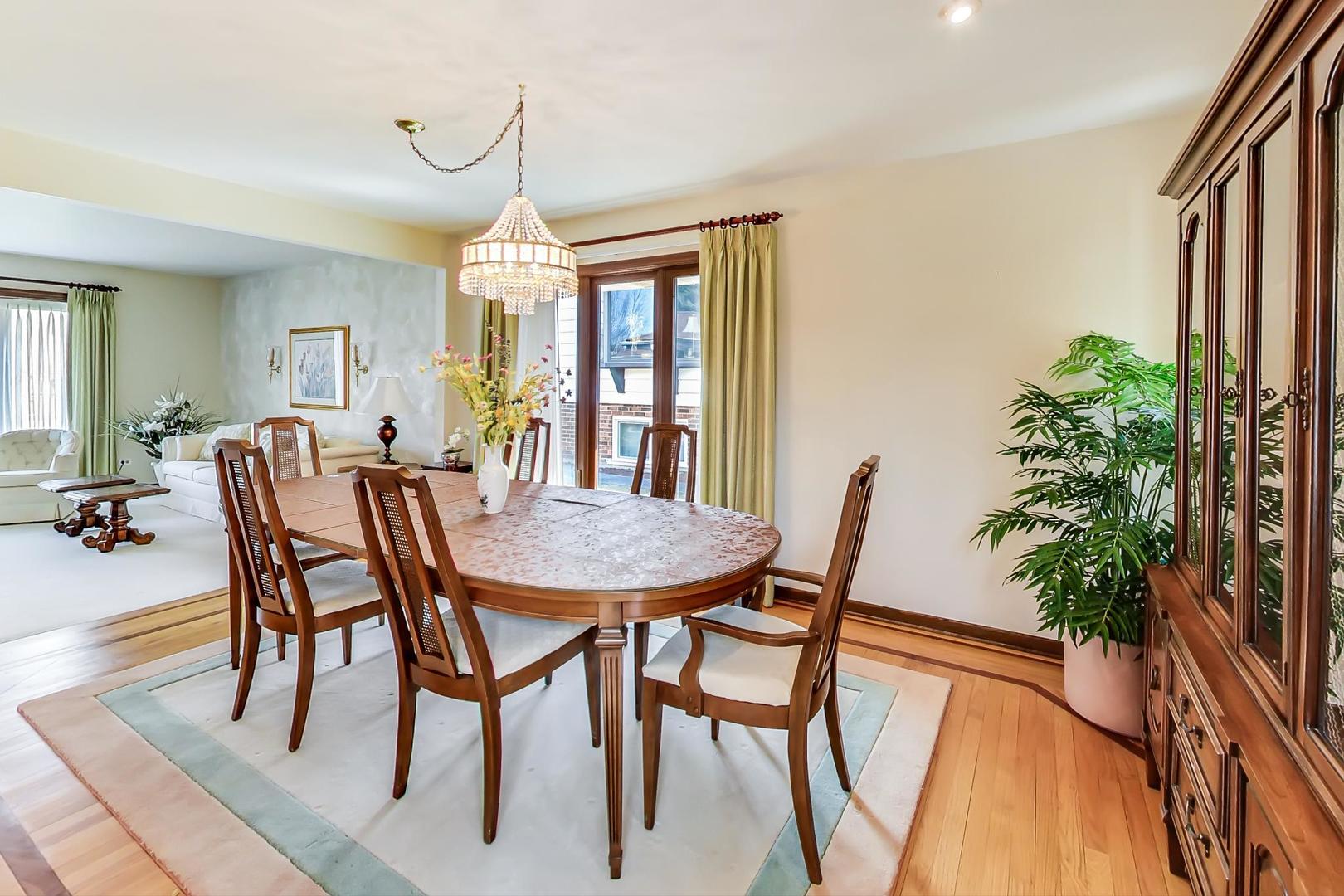 306 North Marcella Road Mount Prospect, IL 60056 - Photo 11 of 31 a dining room with furniture window and wooden floor