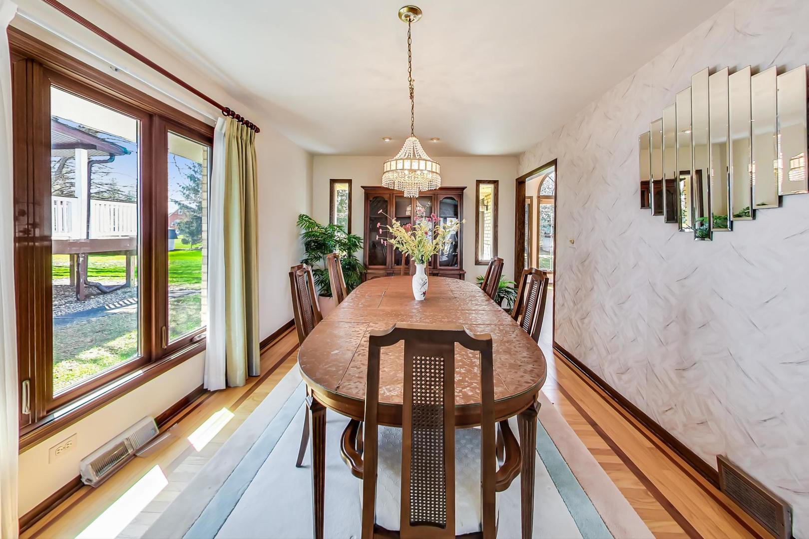 306 North Marcella Road Mount Prospect, IL 60056 - Photo 12 of 31 a view of a dining room with furniture window and wooden floor