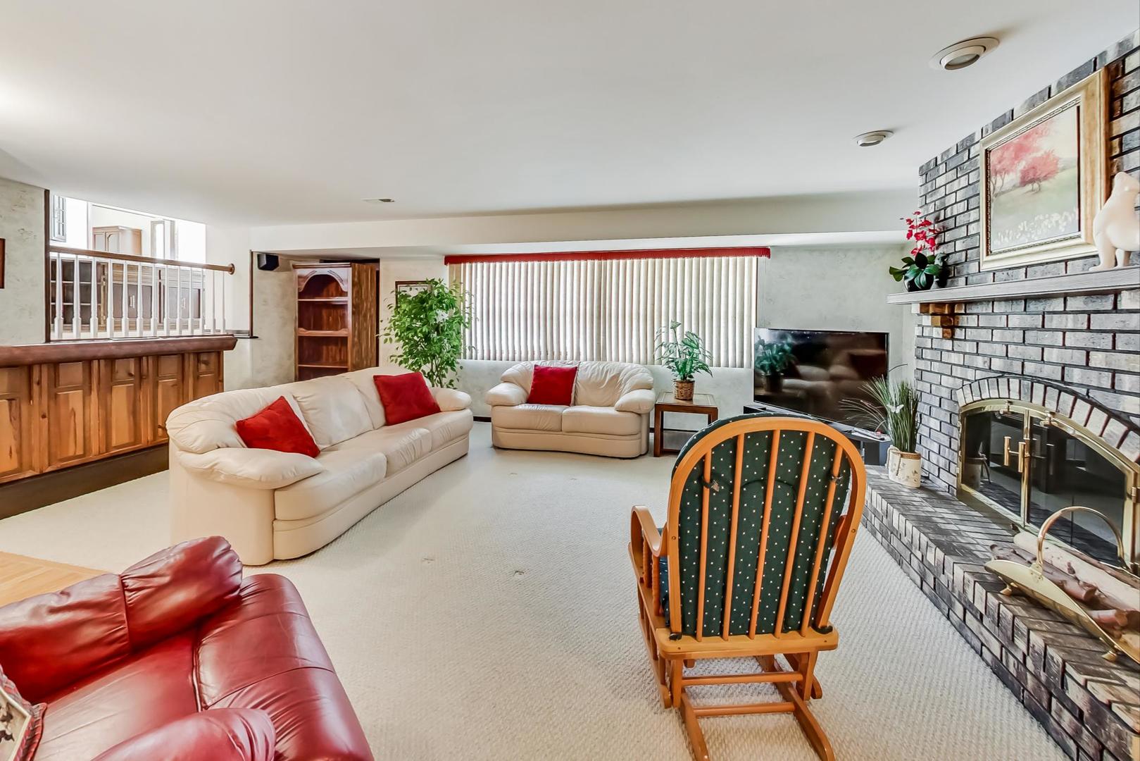 306 North Marcella Road Mount Prospect, IL 60056 - Photo 13 of 31 a living room with furniture fireplace and flat screen tv