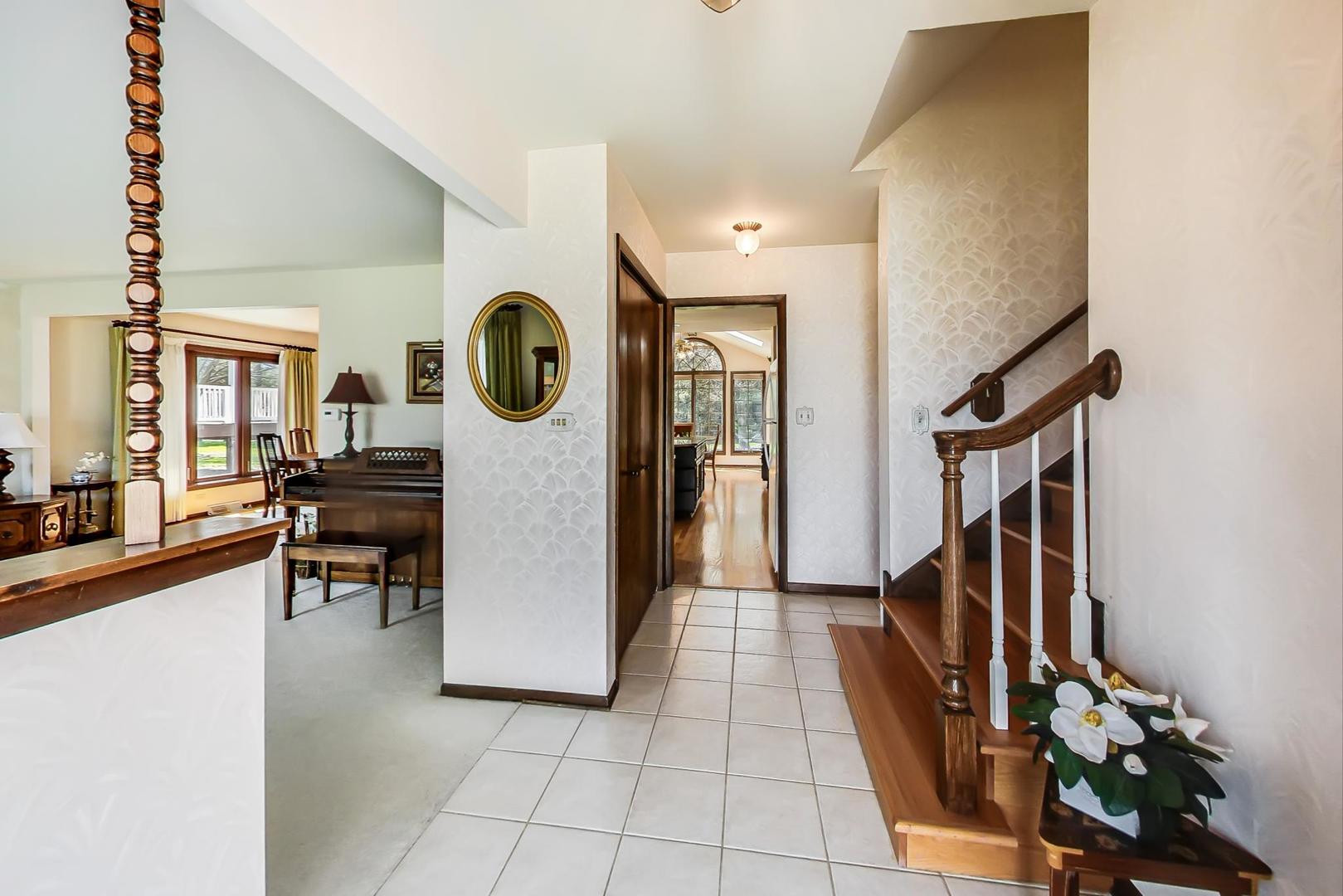 306 North Marcella Road Mount Prospect, IL 60056 - Photo 2 of 31 a view of entryway and hall with wooden floor