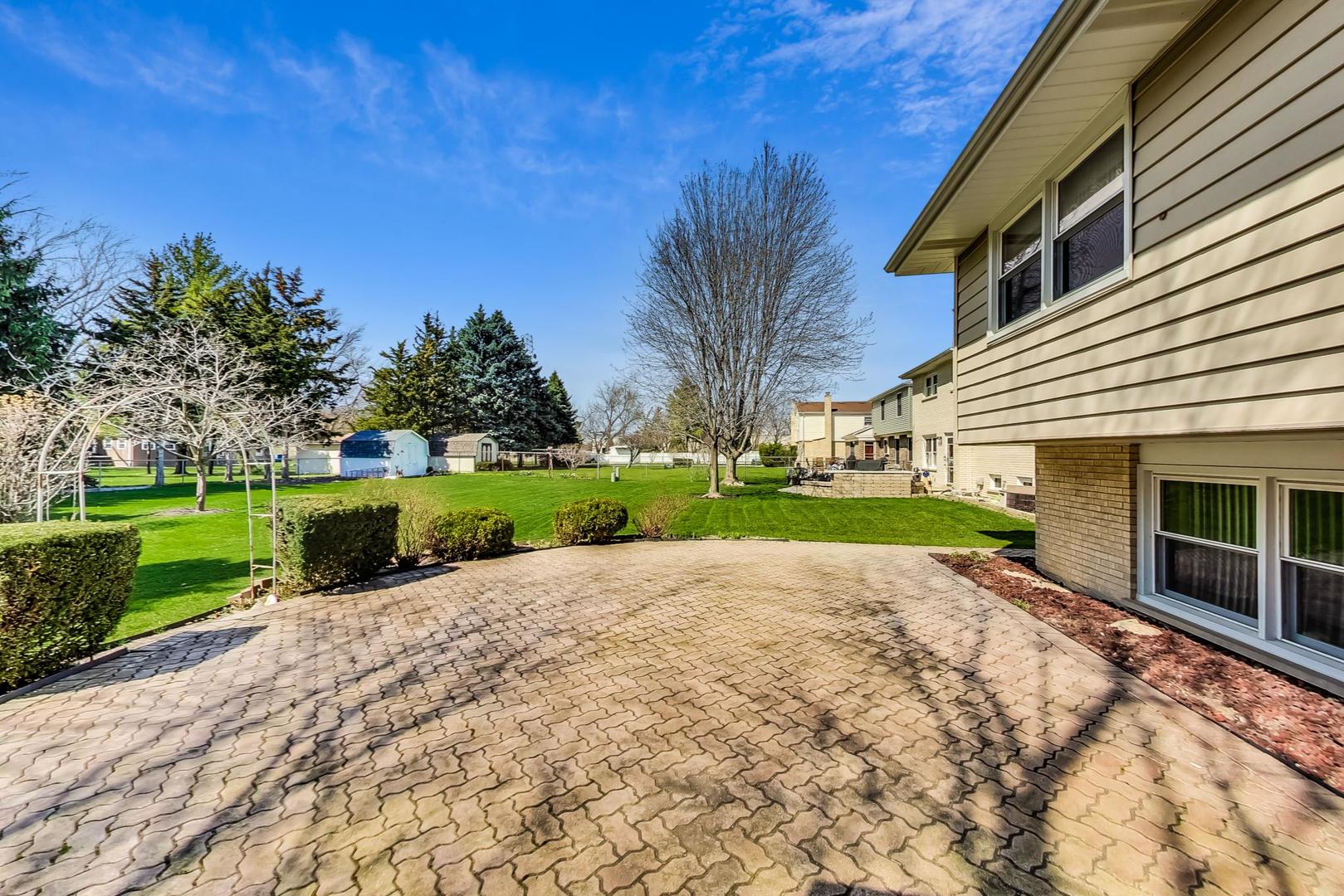306 North Marcella Road Mount Prospect, IL 60056 - Photo 25 of 31 a view of a house with a yard and green space