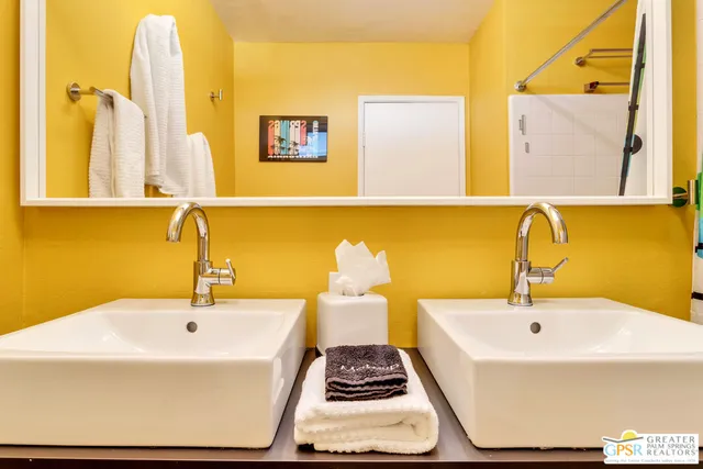 a bathroom with a sink a bathtub and a shower