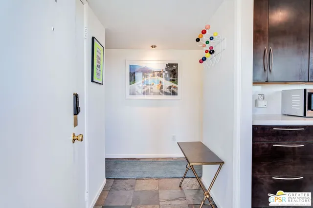 a view of room with furniture and wooden floor