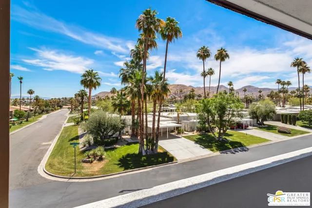 a view of a backyard with sitting area