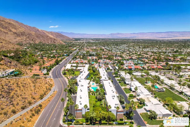 an aerial view of a house a garden and a table