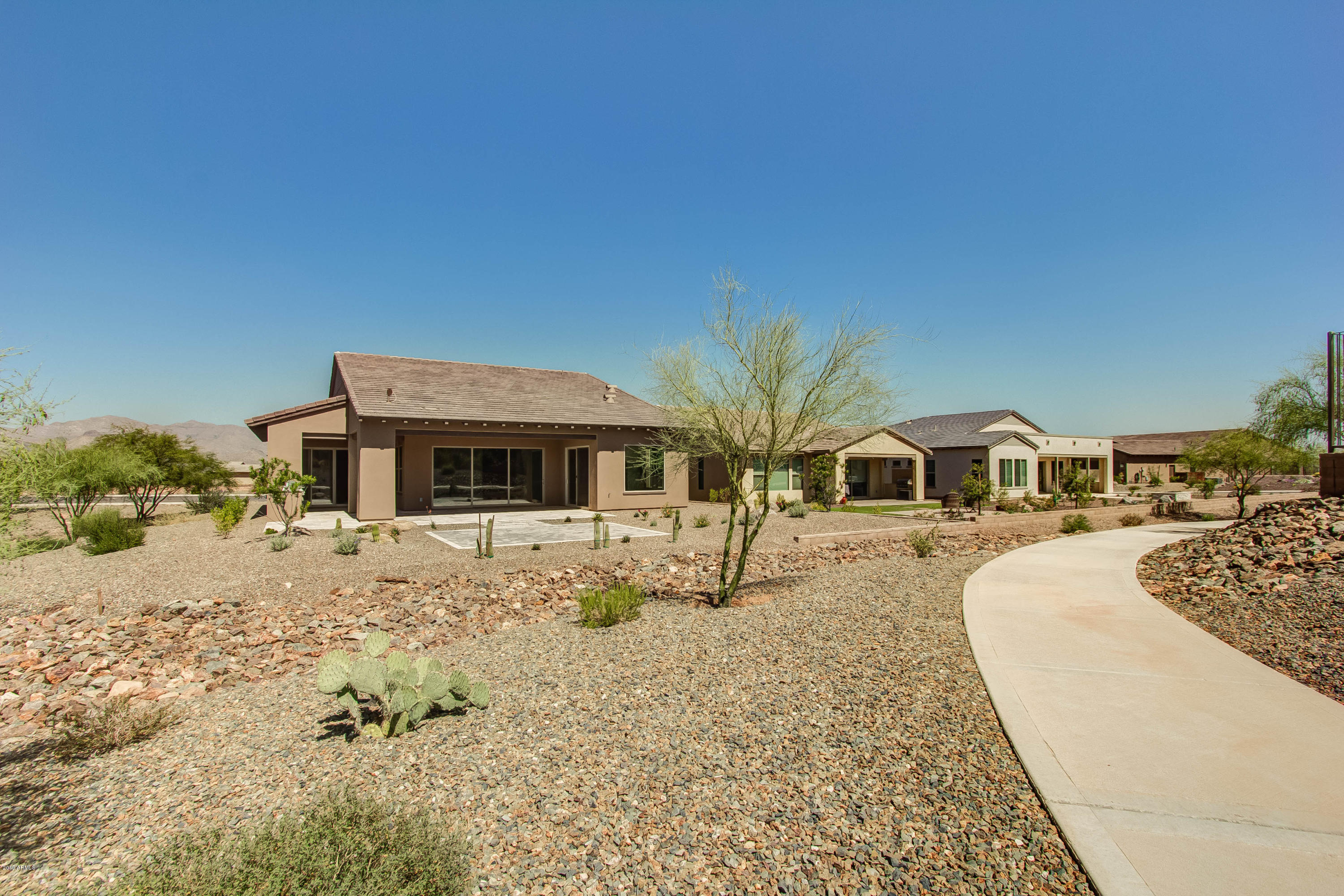 17741 East Woolsey Way Rio Verde, AZ 85263 - Photo 16 of 38 a front view of a house with a yard