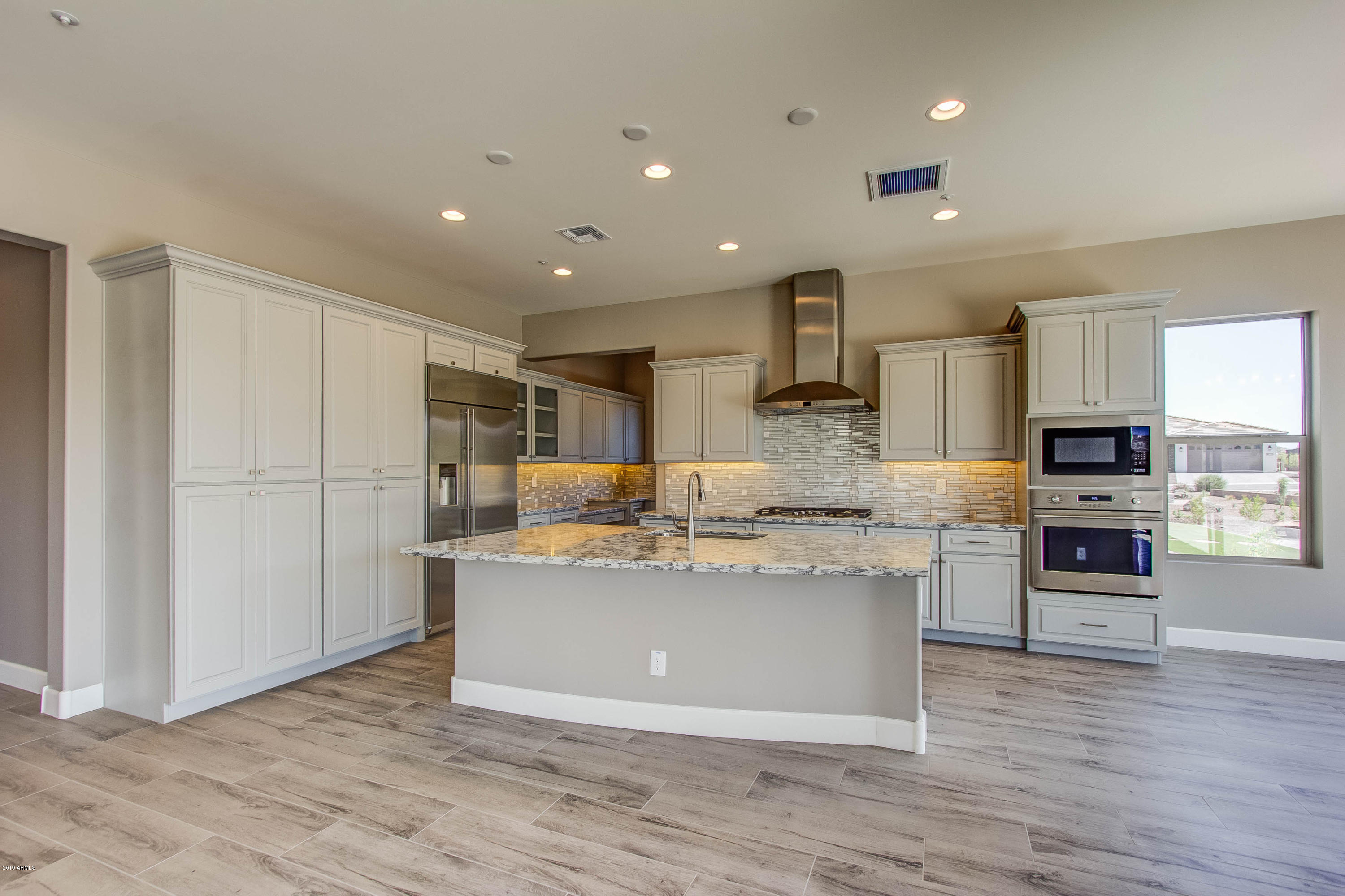 17741 East Woolsey Way Rio Verde, AZ 85263 - Photo 3 of 38 a view of kitchen with stainless steel appliances granite countertop a stove and a sink