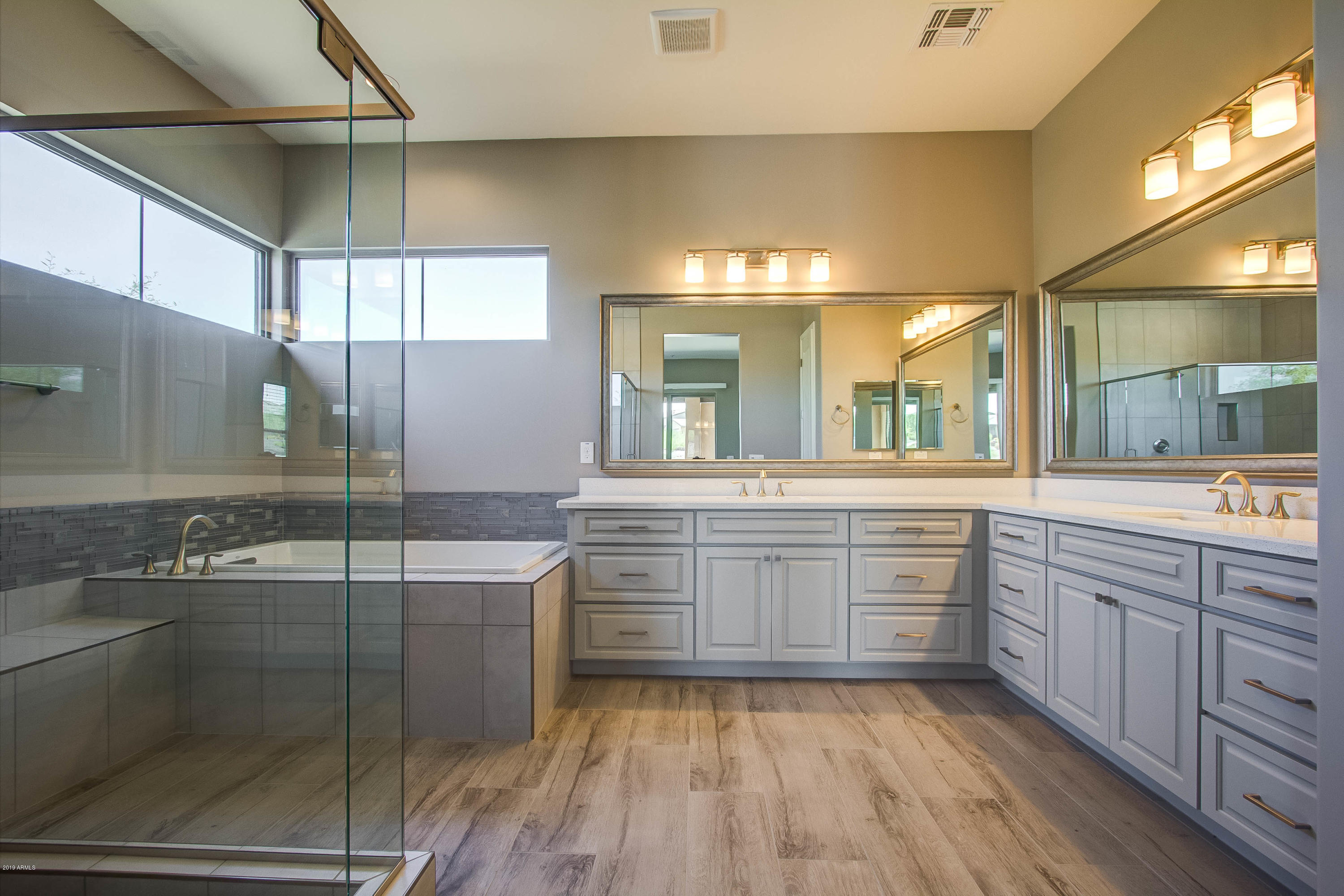 17741 East Woolsey Way Rio Verde, AZ 85263 - Photo 8 of 38 a large bathroom with a large mirror vanity and sink