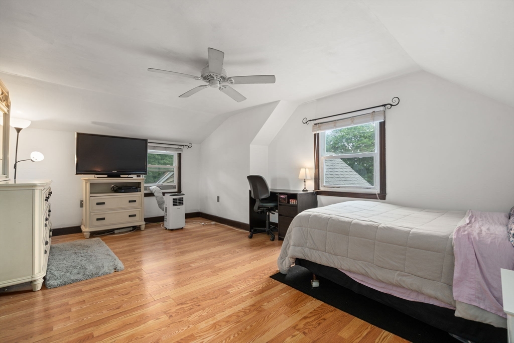 9 Laurel Lane Bellingham, MA 02019 - Photo 29 of 30 a bedroom with a bed and a flat tv screen on the dresser