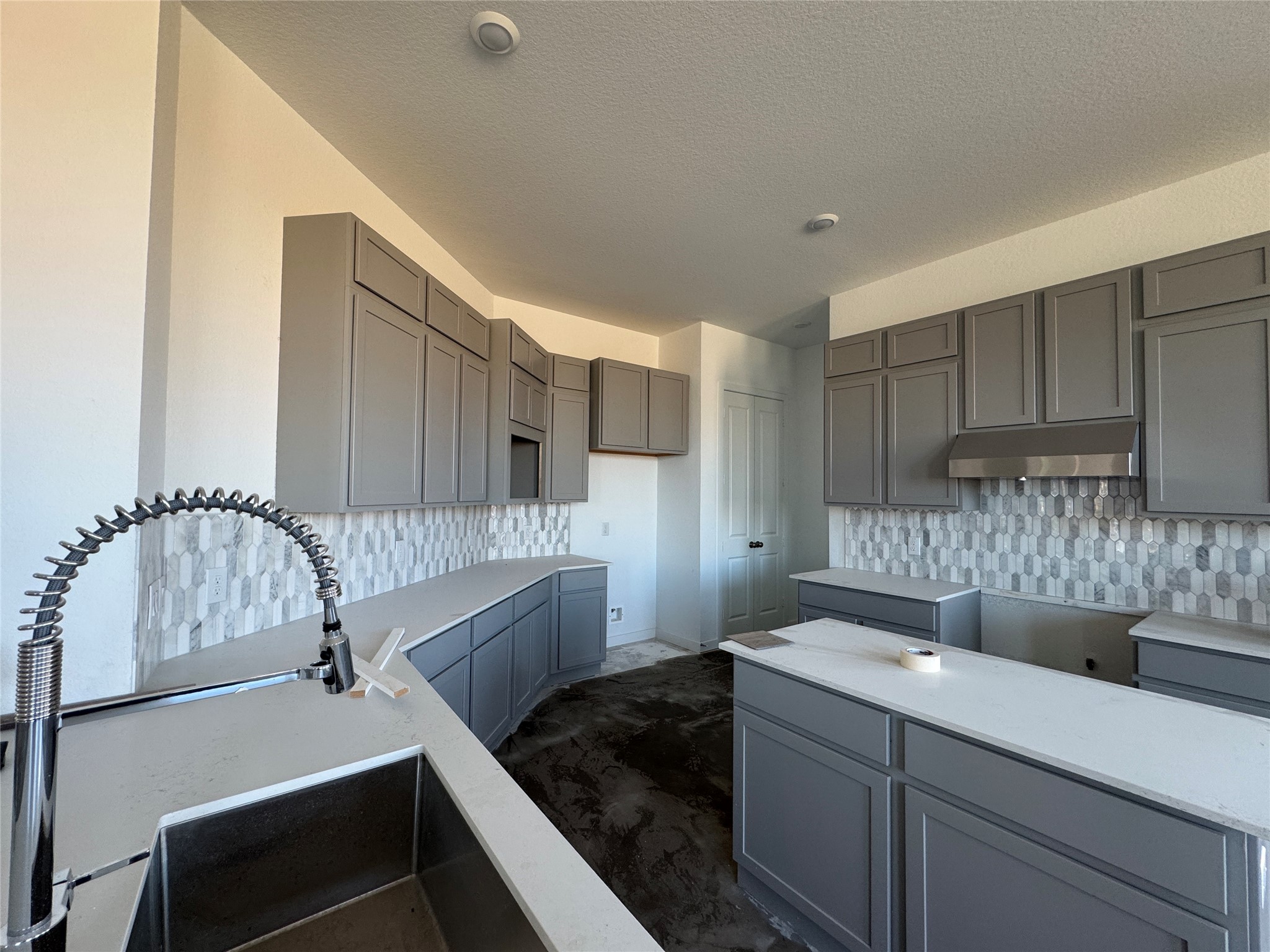 31154 Riley Hts Drive Fulshear, TX 77441 - Photo 4 of 8 a kitchen with a sink and a refrigerator
