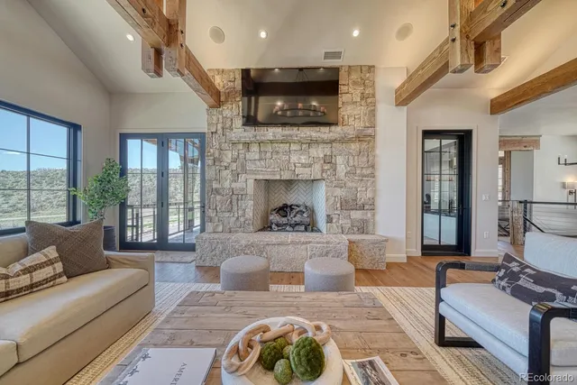 a living room with furniture fireplace and flat screen tv