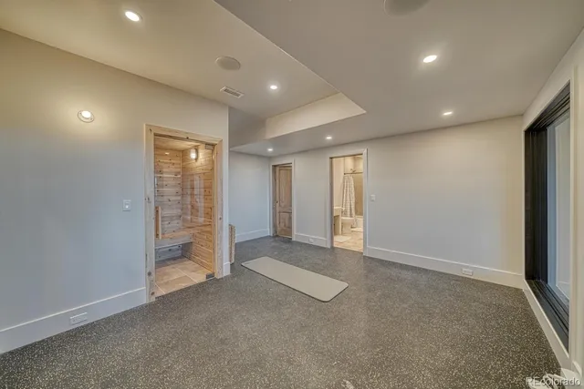 an empty room with closet and wooden floor