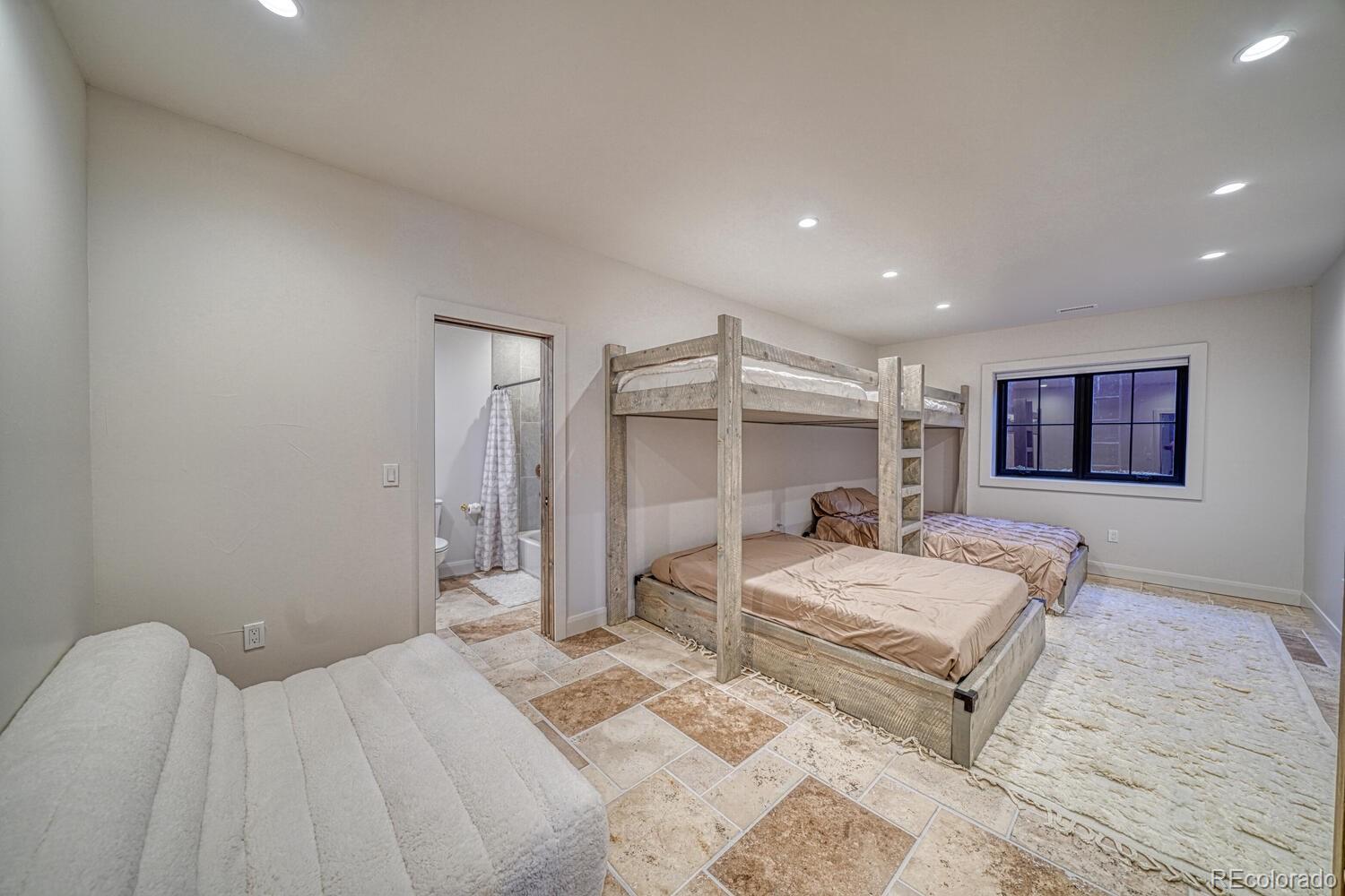 1768 Running Bear Cotopaxi, CO 81223 - Photo 37 of 50 a bedroom with a bed and a flat screen tv