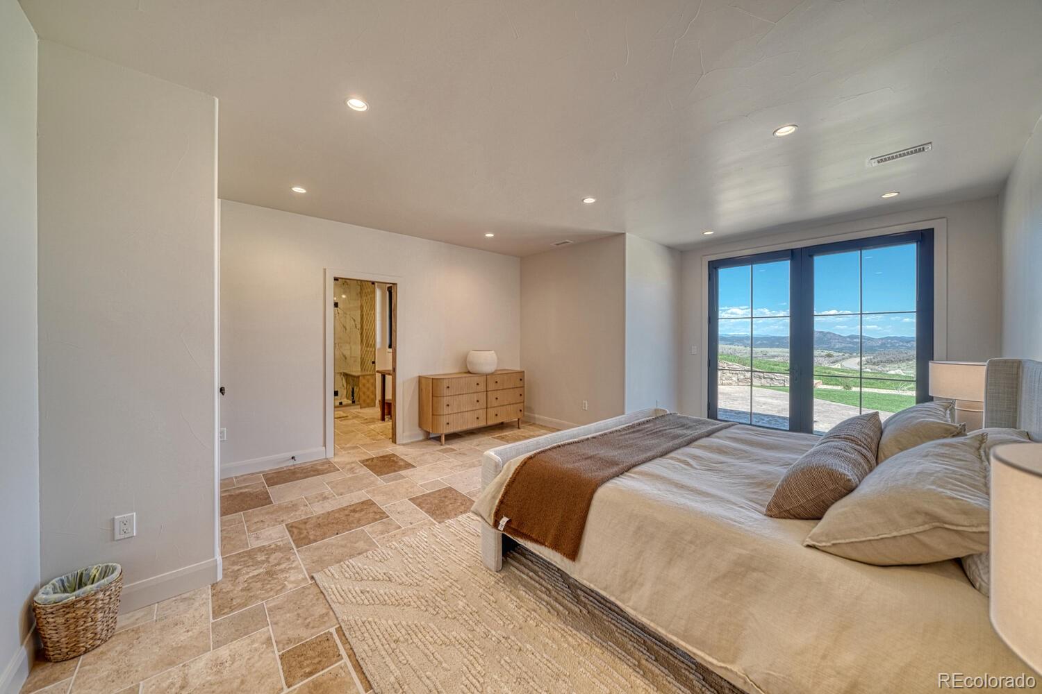 1768 Running Bear Cotopaxi, CO 81223 - Photo 40 of 50 a spacious bedroom with a large bed and a large window