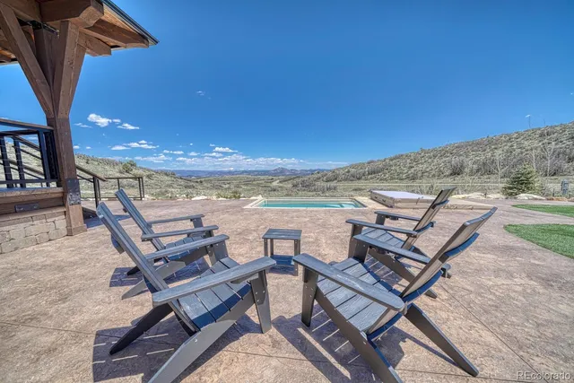 a view of a ocean with lawn chairs