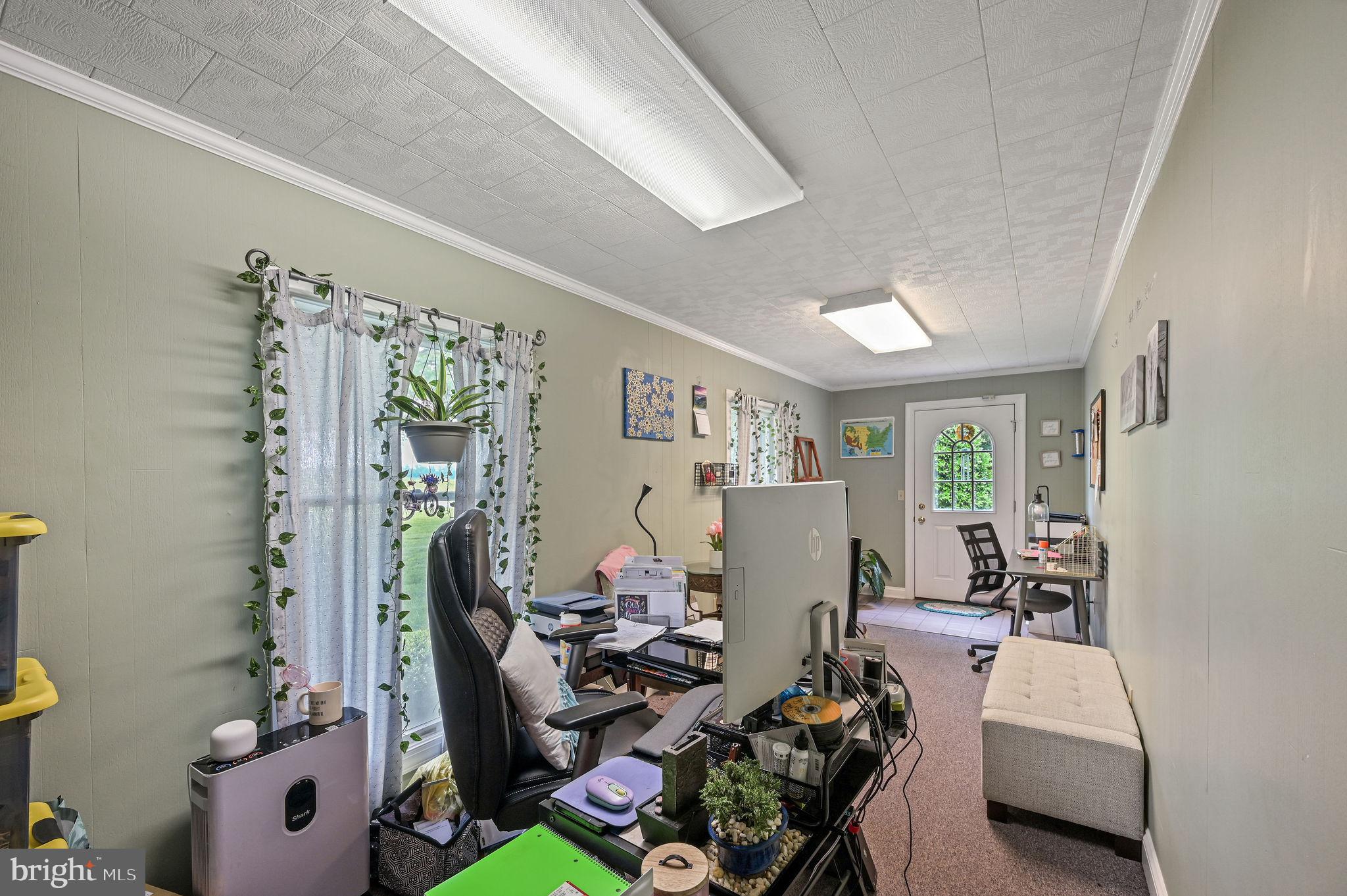 11142 Log Cabin Road Denton, MD 21629 - Photo 12 of 55 a living room with furniture and a window