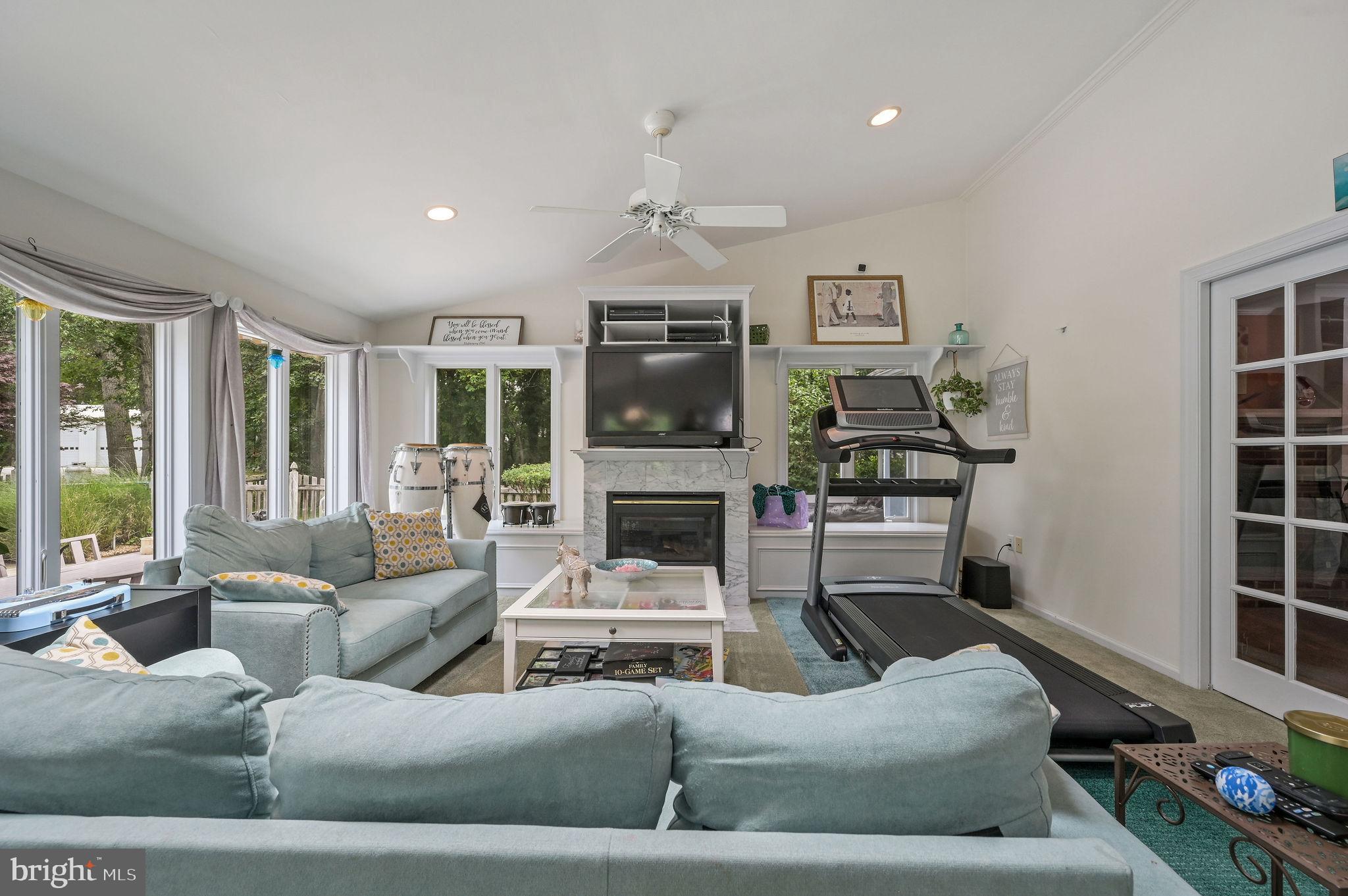 11142 Log Cabin Road Denton, MD 21629 - Photo 16 of 55 a living room with furniture and a fireplace