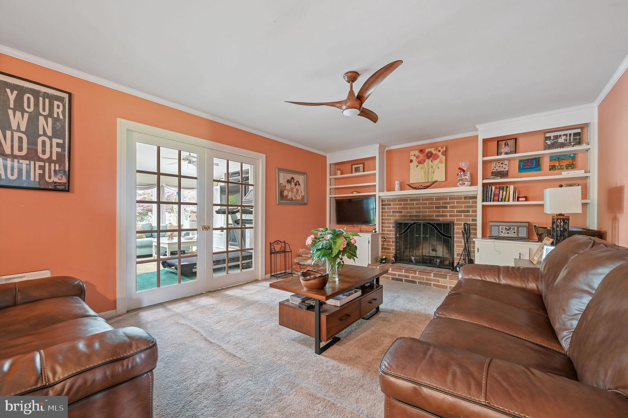 11142 Log Cabin Road Denton, MD 21629 - Photo 19 of 55 a living room with furniture large window and a fireplace