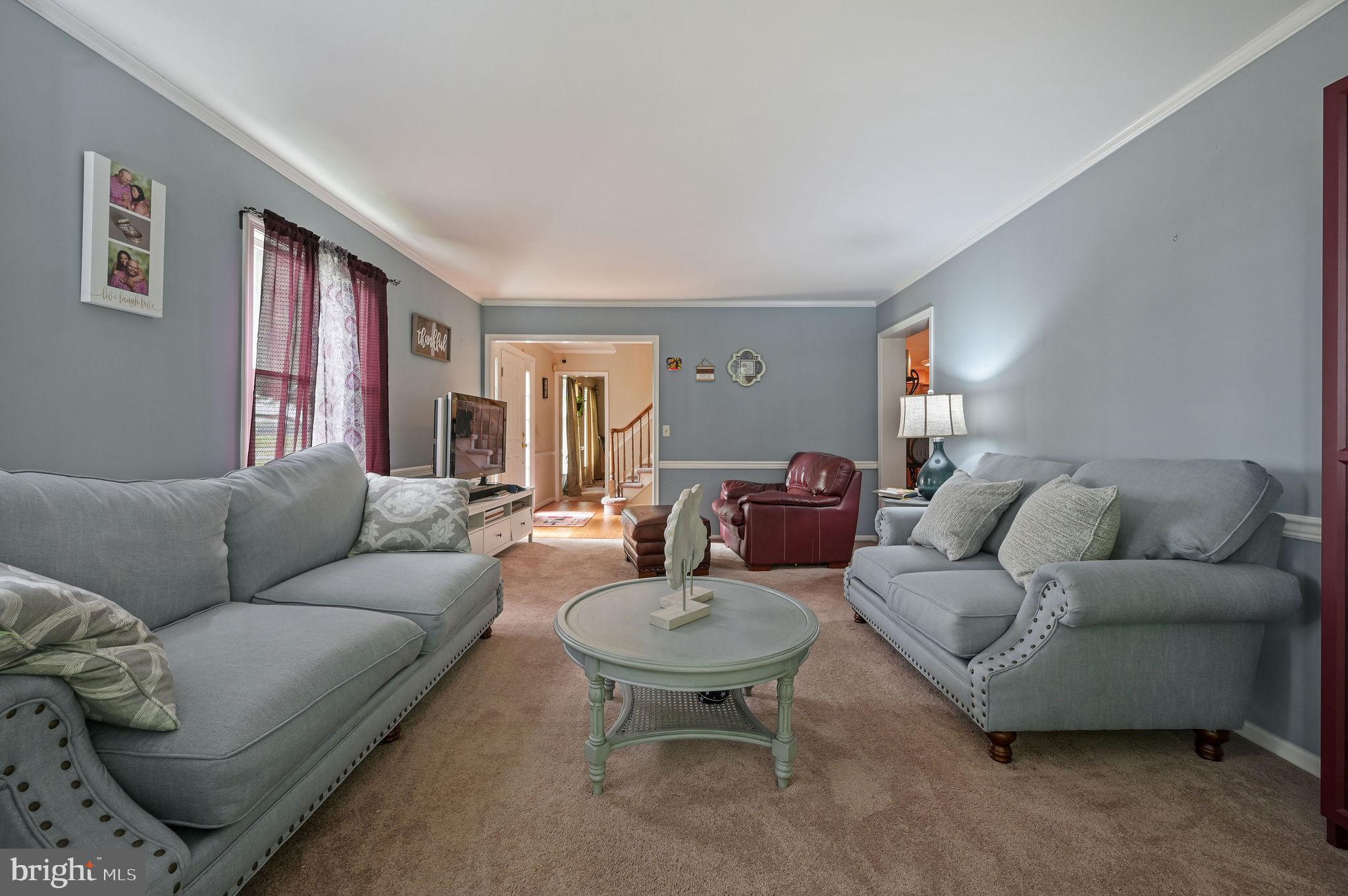 11142 Log Cabin Road Denton, MD 21629 - Photo 22 of 55 a living room with furniture potted plant and a window