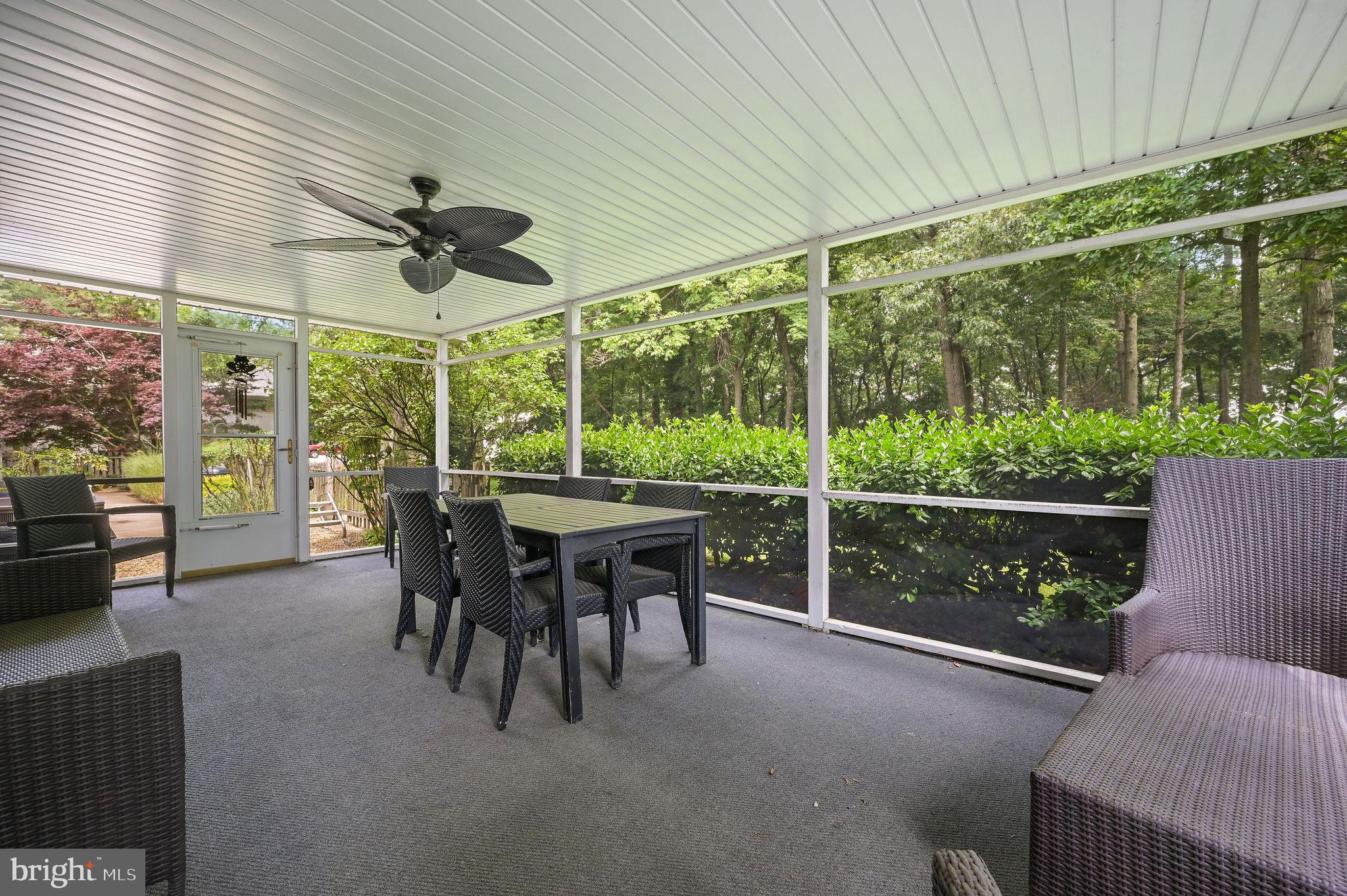 11142 Log Cabin Road Denton, MD 21629 - Photo 23 of 55 a view of a porch with furniture and a yard