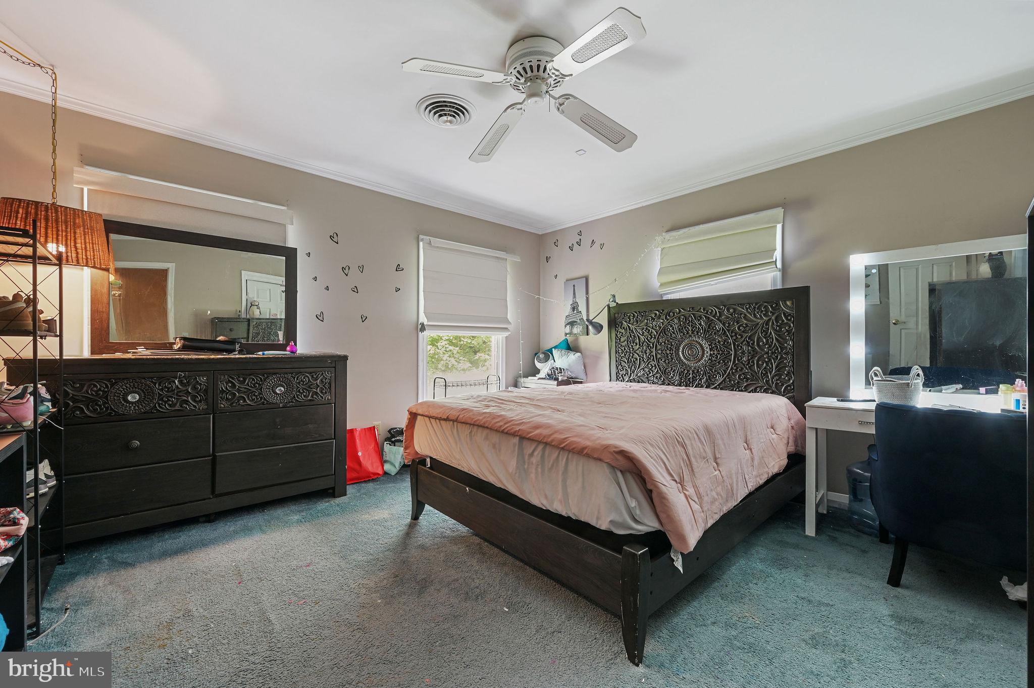 11142 Log Cabin Road Denton, MD 21629 - Photo 24 of 55 a bedroom with a bed and a dresser