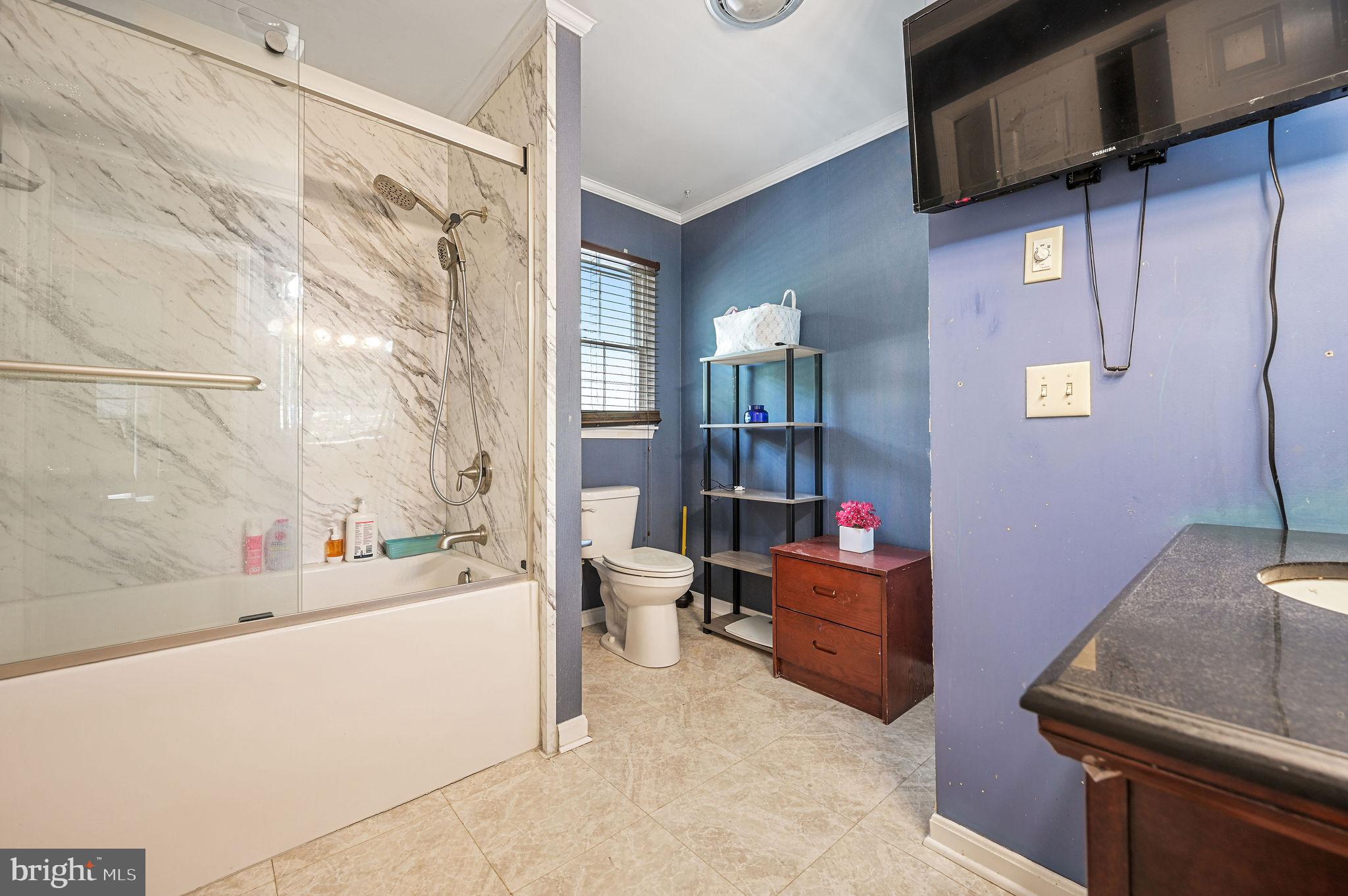 11142 Log Cabin Road Denton, MD 21629 - Photo 27 of 55 a room with furniture and a kitchen area