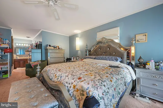 a bathroom with a sink vanity and mirror