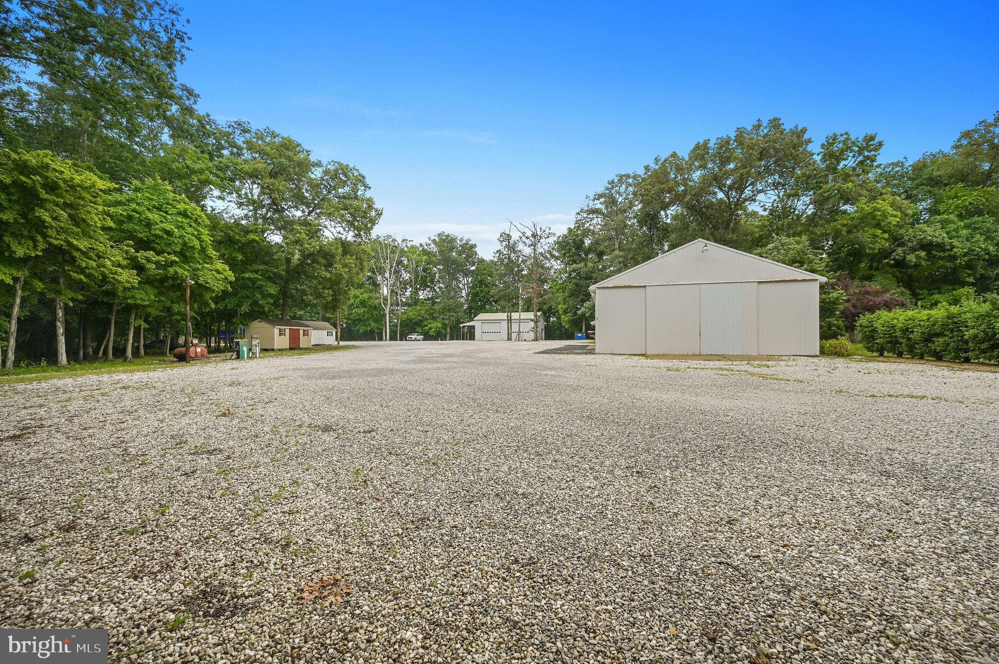 11142 Log Cabin Road Denton, MD 21629 - Photo 36 of 55 a house with trees in front of it