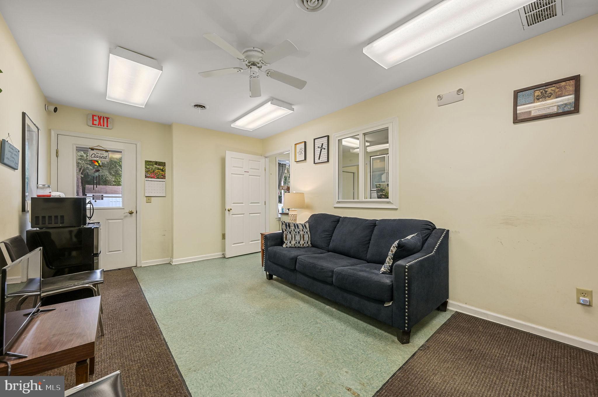 11142 Log Cabin Road Denton, MD 21629 - Photo 40 of 55 a living room with furniture and a flat screen tv