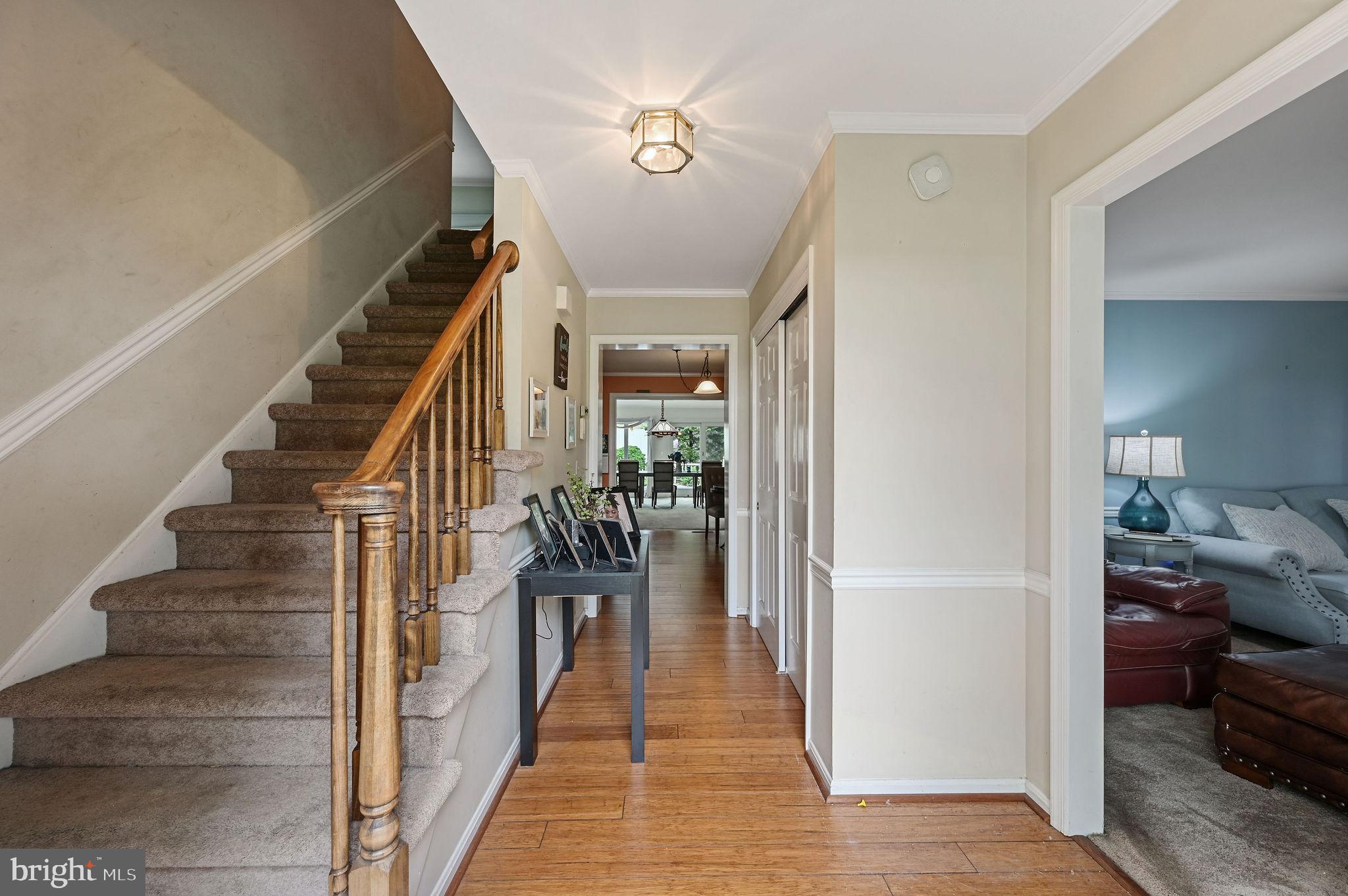 11142 Log Cabin Road Denton, MD 21629 - Photo 4 of 55 a view of a hallway with wooden floor and stairs