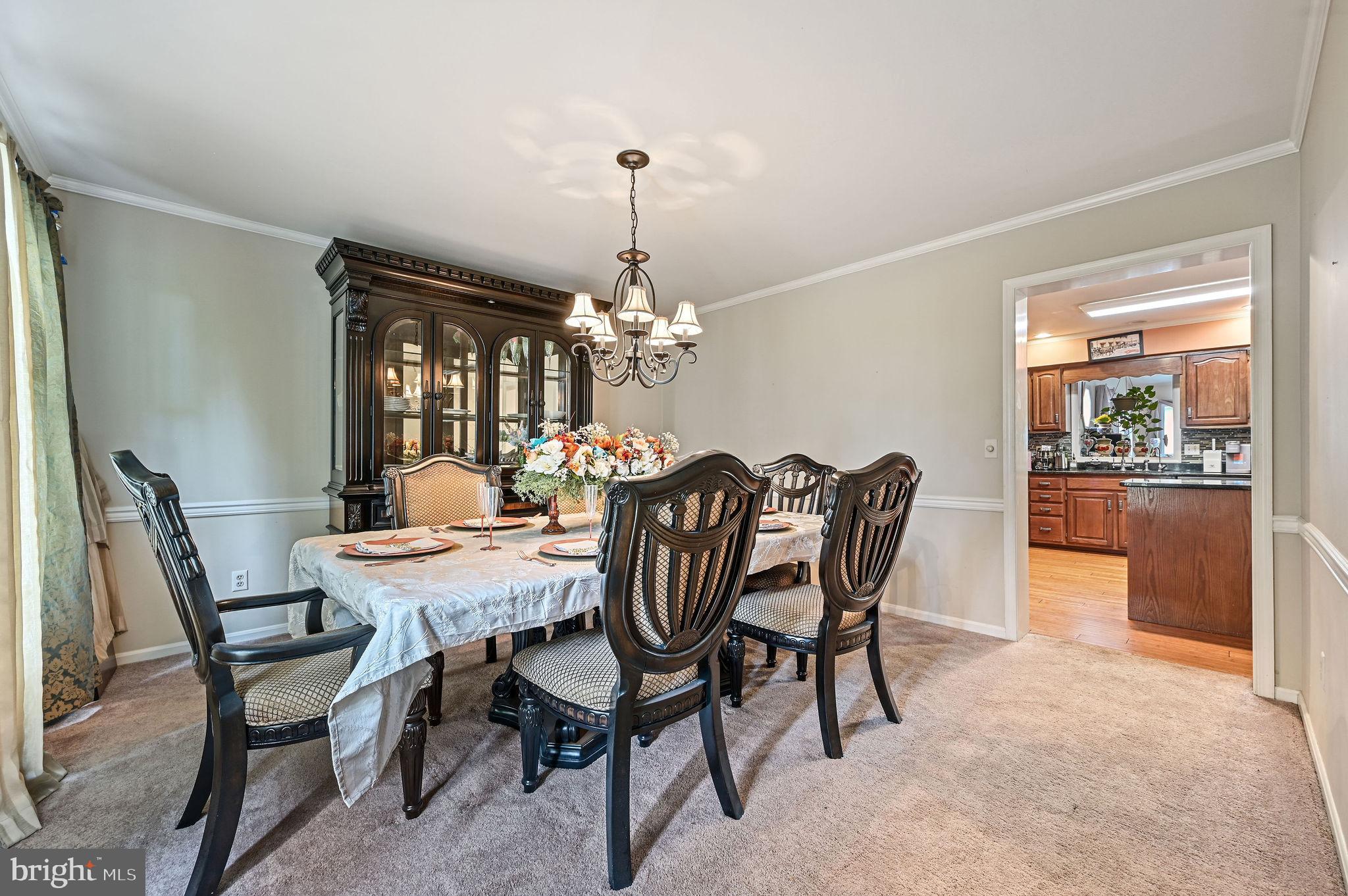 11142 Log Cabin Road Denton, MD 21629 - Photo 5 of 55 a dining room with furniture a chandelier and window