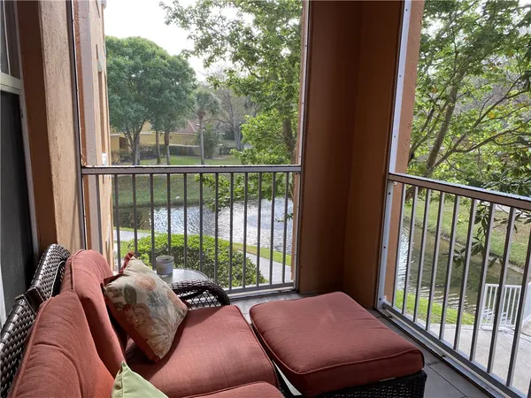 a view of a balcony with chairs