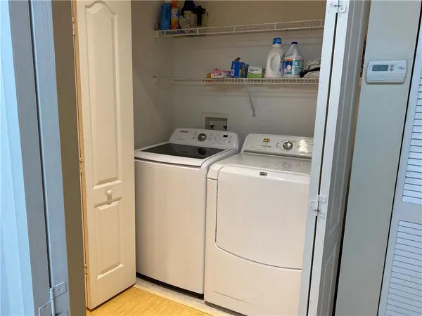 a bedroom with bed and a window
