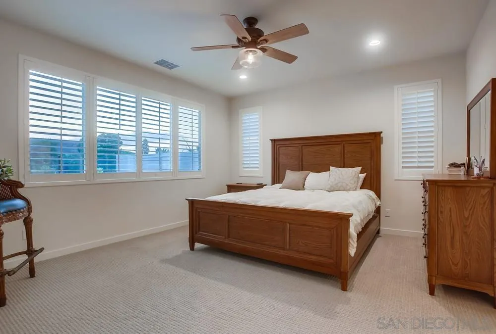 31534 Calle De Las Rosas Bonsall, CA 92003 - Photo 16 of 27 a bed sitting in a room next to a window