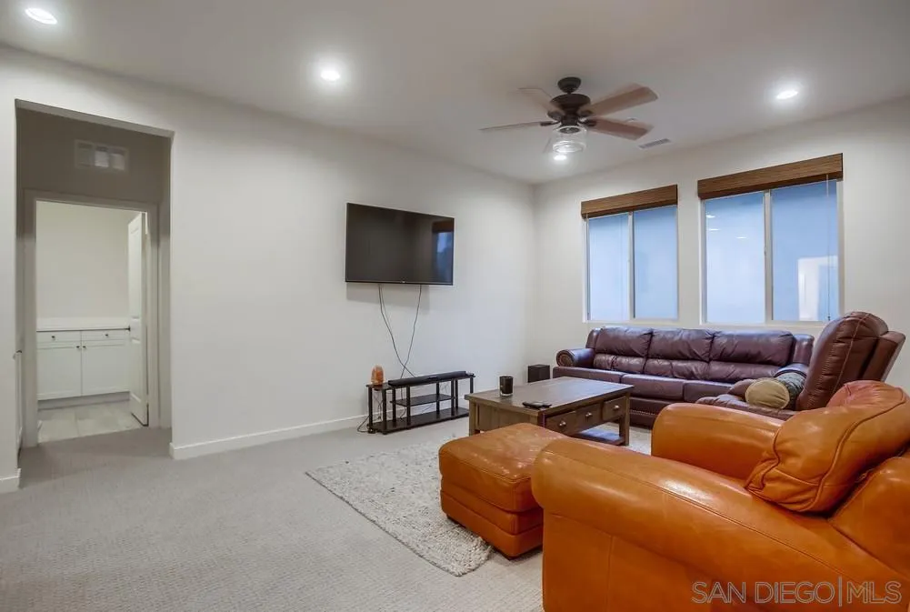 31534 Calle De Las Rosas Bonsall, CA 92003 - Photo 23 of 27 a living room with furniture and a flat screen tv