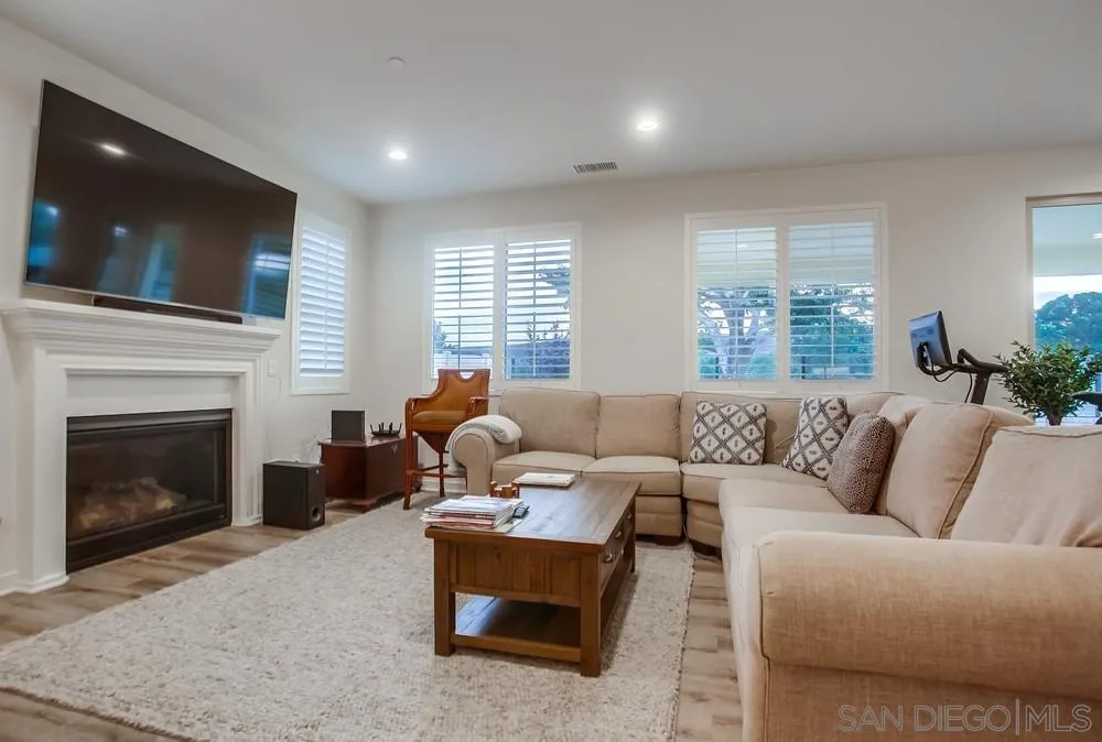 31534 Calle De Las Rosas Bonsall, CA 92003 - Photo 6 of 27 a living room with furniture and a fireplace