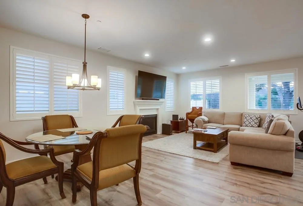 31534 Calle De Las Rosas Bonsall, CA 92003 - Photo 8 of 27 a living room with fireplace furniture and a wooden floor
