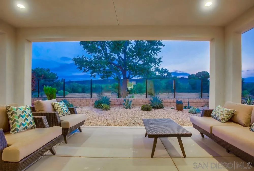 31534 Calle De Las Rosas Bonsall, CA 92003 - Photo 9 of 27 a outdoor living space with furniture and a potted plant
