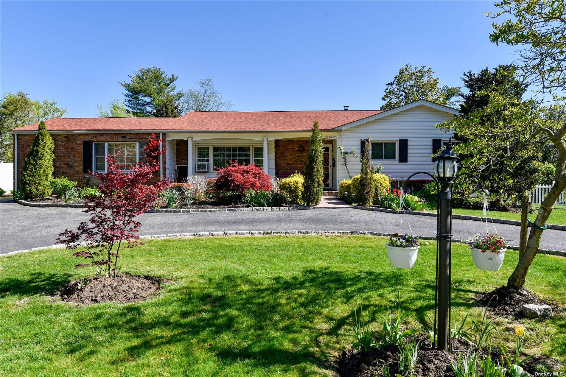 a front view of house with yard and outdoor seating