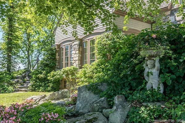 front view of a house with a garden