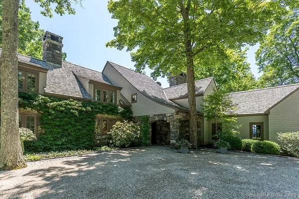 front view of a house with a tree