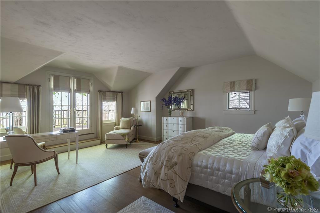33 Nodine Pasture Road Kent, CT 06757 - Photo 20 of 40 a bedroom with a bed and wooden floor