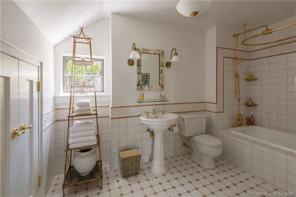 a bathroom with a toilet sink and shower