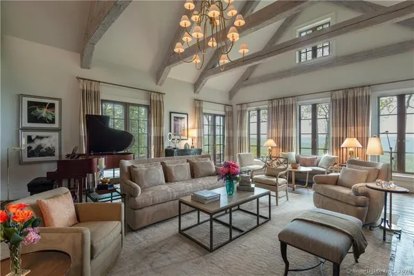 a living room with furniture or couch and a large window