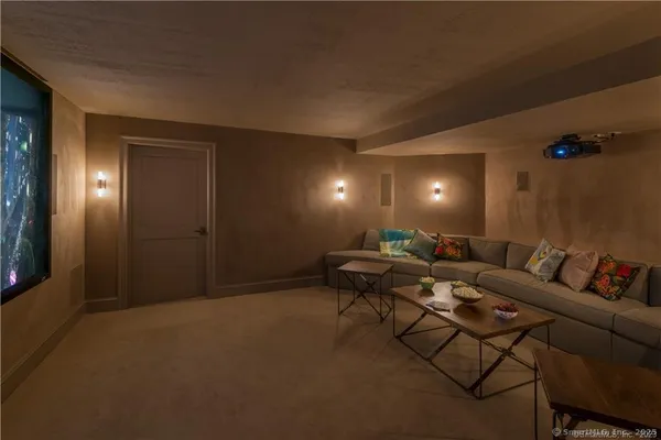 a living room with furniture and a lamp