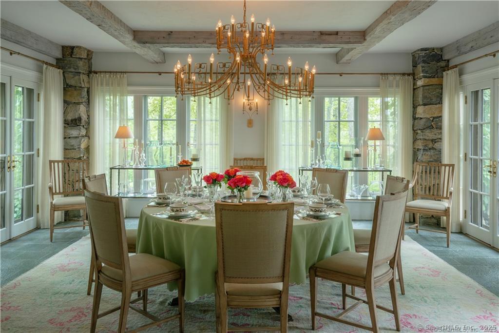 33 Nodine Pasture Road Kent, CT 06757 - Photo 9 of 40 a dining room with furniture a chandelier and wooden floor