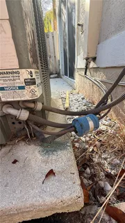 a view of swimming pool with a lounge chairs