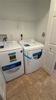 a utility room with washer and dryer